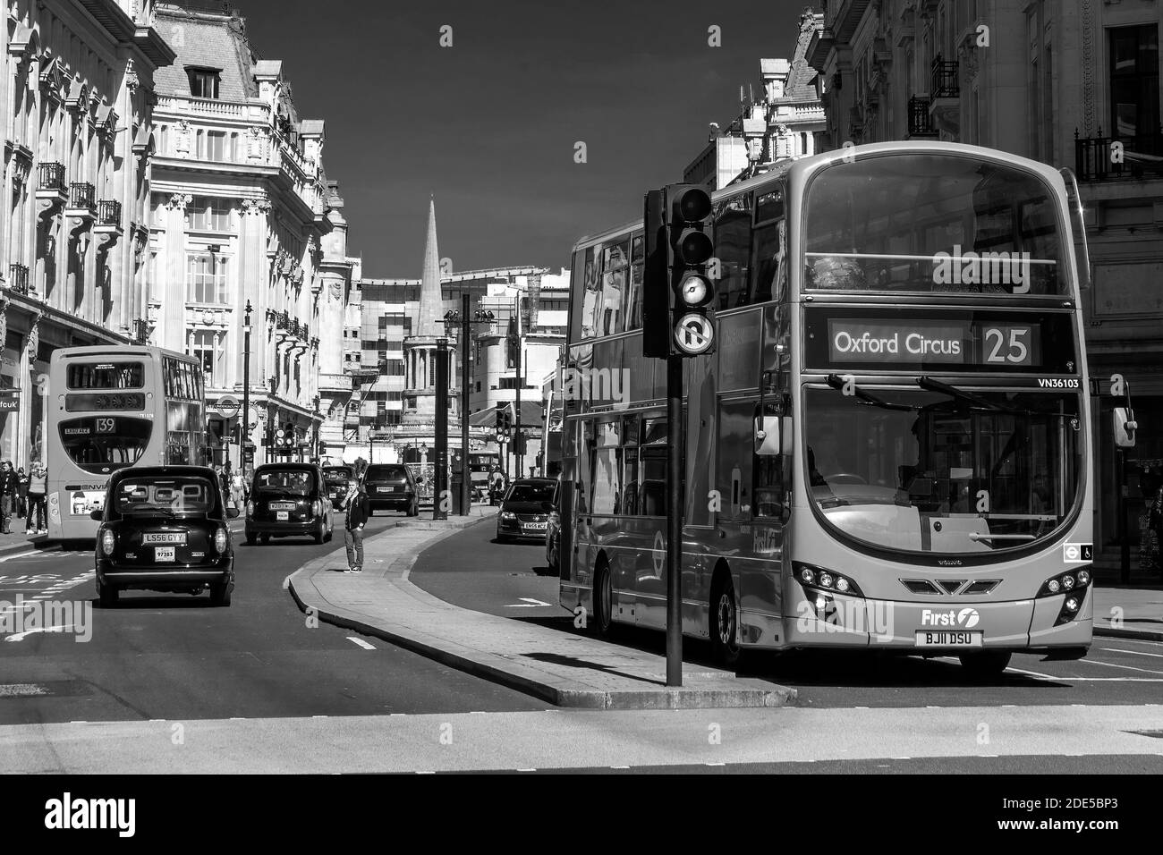 London, UK, April 1, 2012 : New modern Routemaster double decker red bus in New Oxford Street which is part of the cities public transport infrastruct Stock Photo