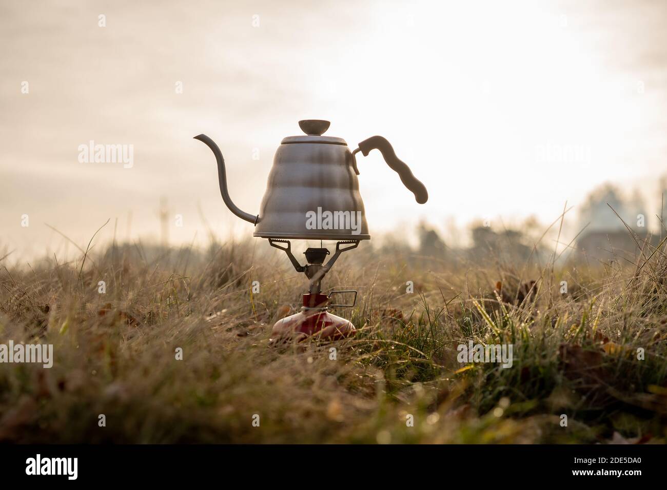 Boiling water for coffee on the meadow Stock Photo Alamy