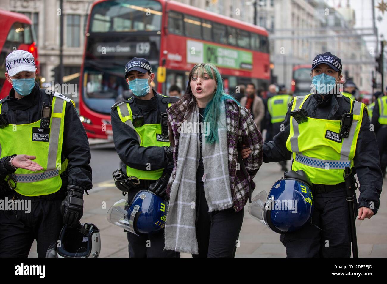 Riot Police arrest over 150 protesters in Oxford Street during anti-lockdown demonstrations across the capital London, England, UK Stock Photo
