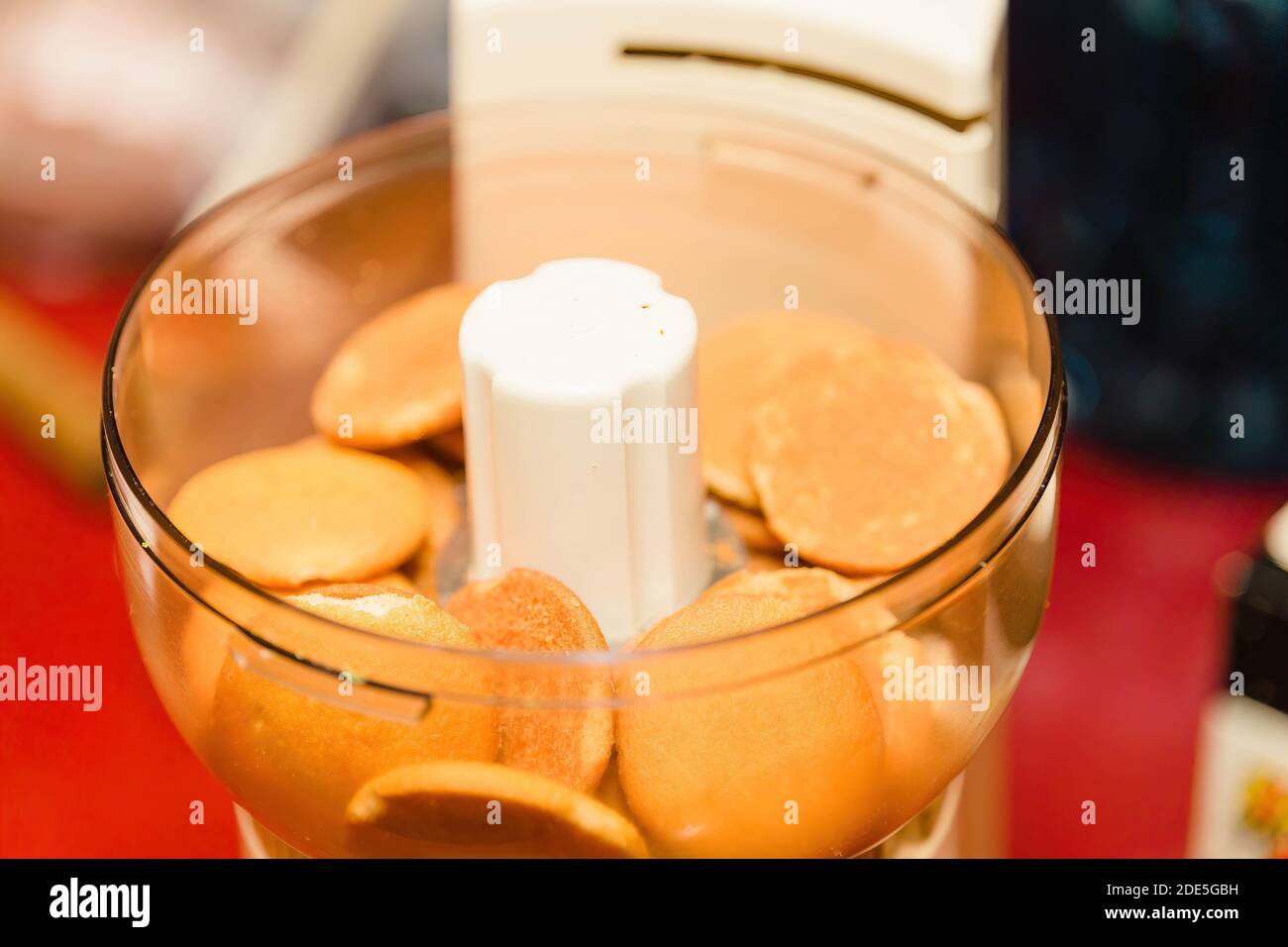 vanilla wafer cookies in a food processor waiting to be ground up Stock Photo