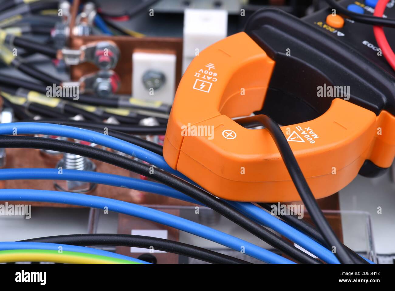 Clamp meter measure current on cable on power supply devices Stock