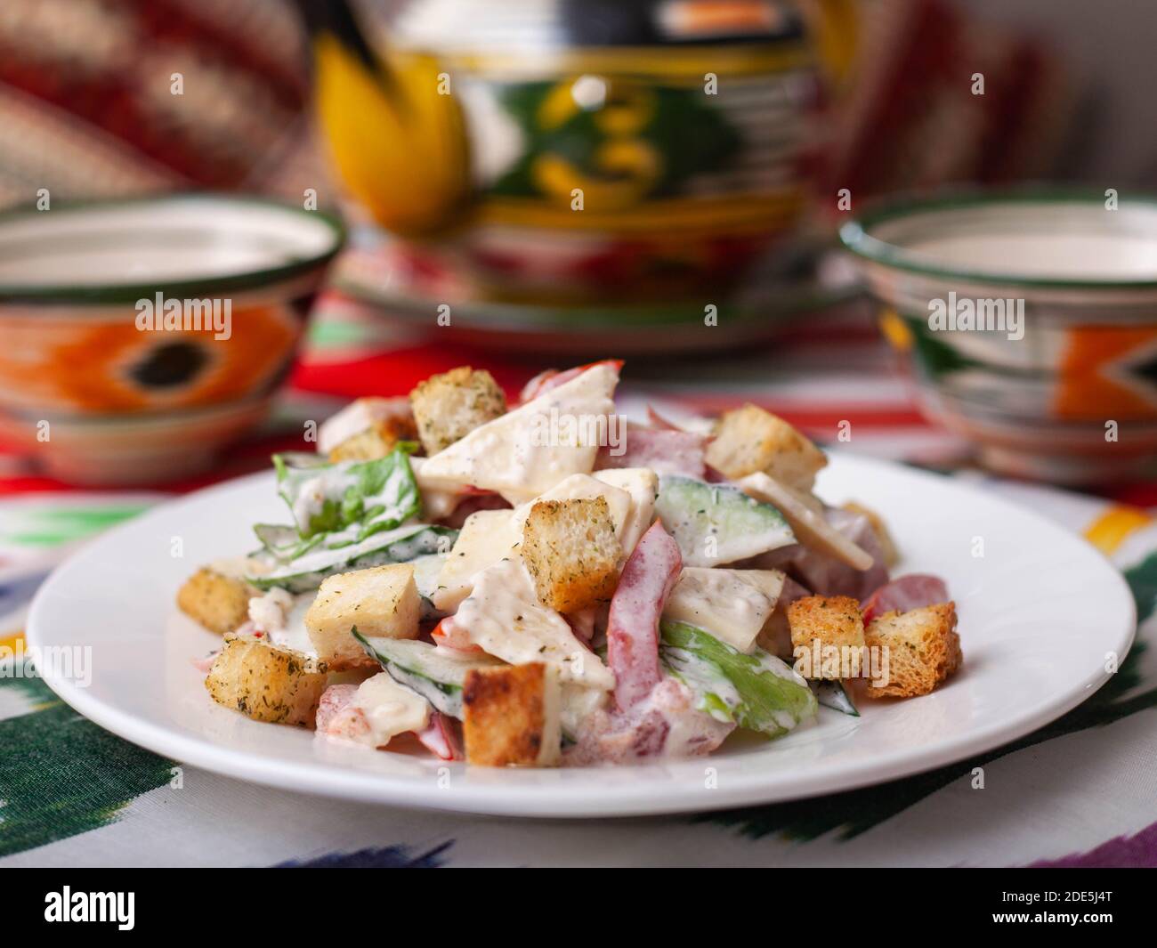 Malibu salad with crab sticks and croutons, feta cheese and vegetables. Asian style Stock Photo