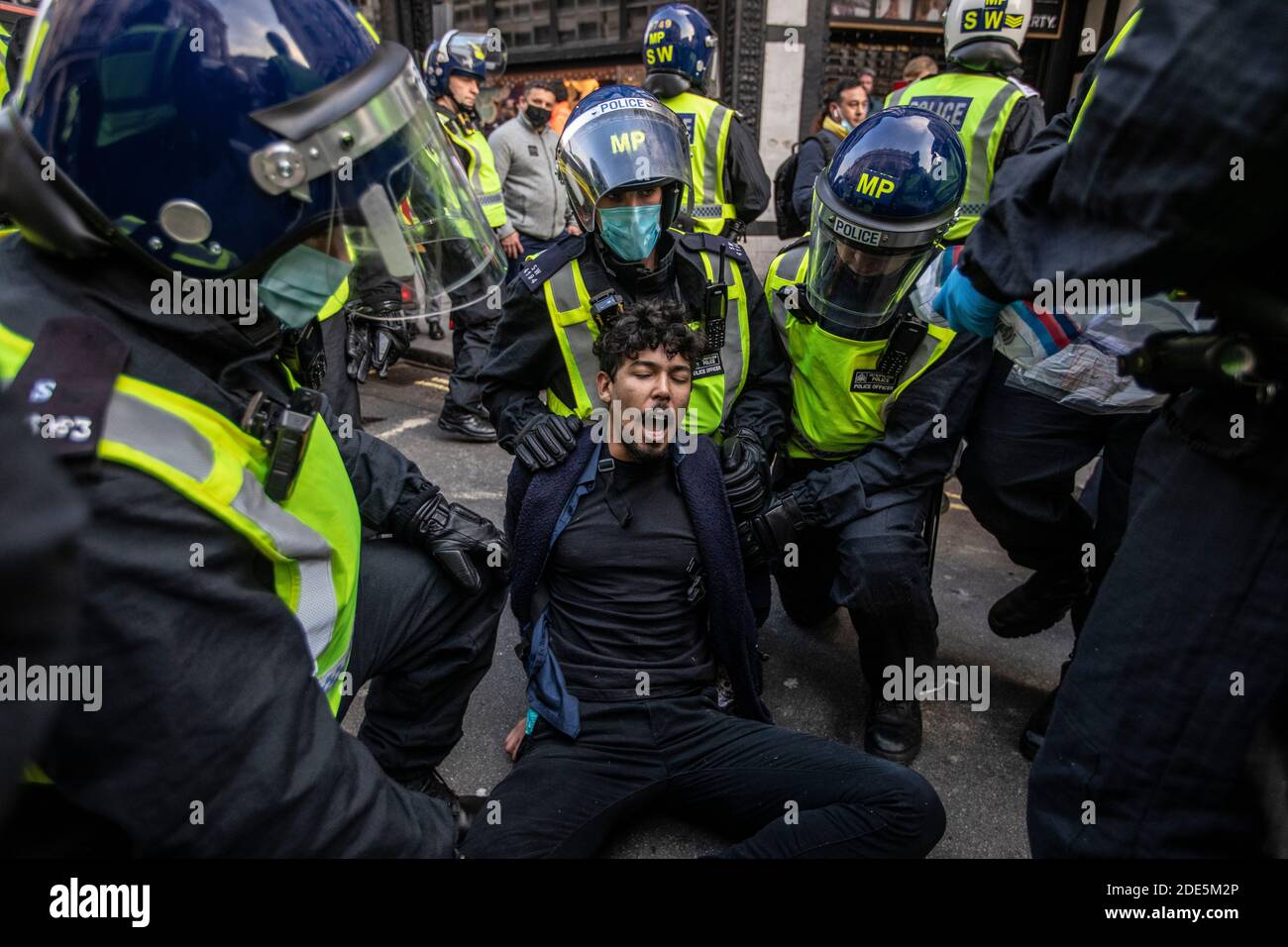Riot Police arrest over 150 protesters in Oxford Street during anti-lockdown demonstrations across the capital London, England, UK Stock Photo