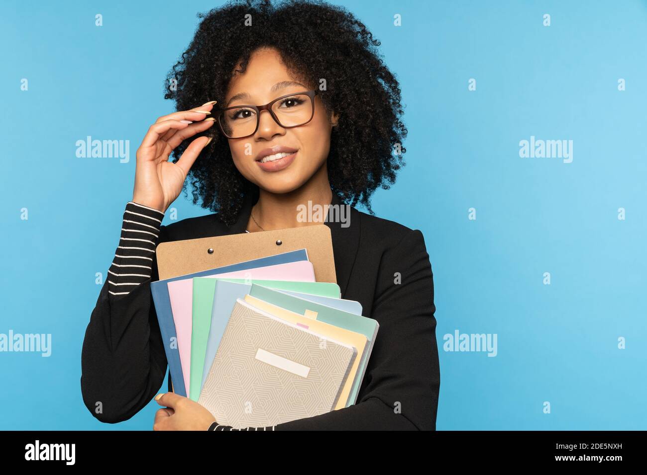 Businesswoman in black blazer hi-res stock photography and images - Alamy