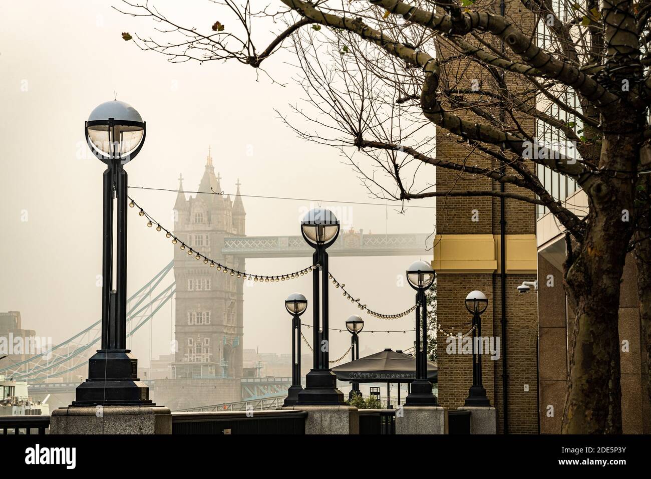 Tower Bridge, iconic London landmark in foggy and misty atmospheric moody weather in London City Centre on Coronavirus Covid-19 lockdown day one, England, UK Stock Photo