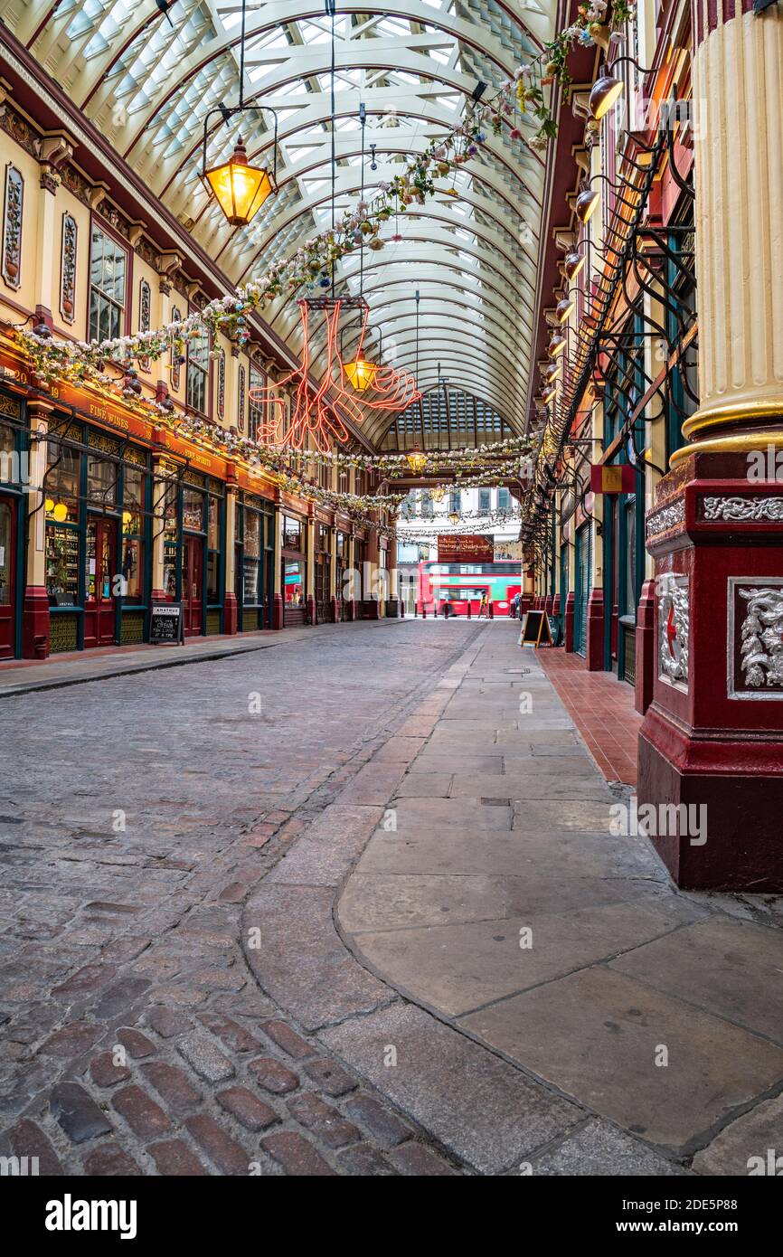 City of London in Coronavirus Covid-19 lockdown with empty streets, quiet deserted roads, no people and closed shops shut during the global pandemic at Leadenhall Market in England, Europe Stock Photo