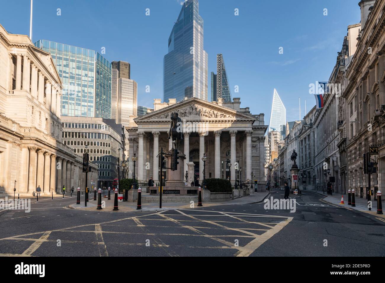 Royal Exchange and Bank of England with empty roads and quiet streets with almost no people during the Coronavirus pandemic Covid-19 lockdown, taken at rush hour, City of London, England, Europe Stock Photo