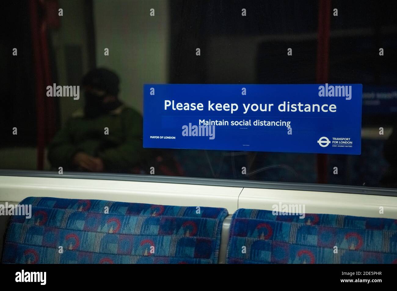 Person wearing face mask on public transport, with Covid19 Coronavirus