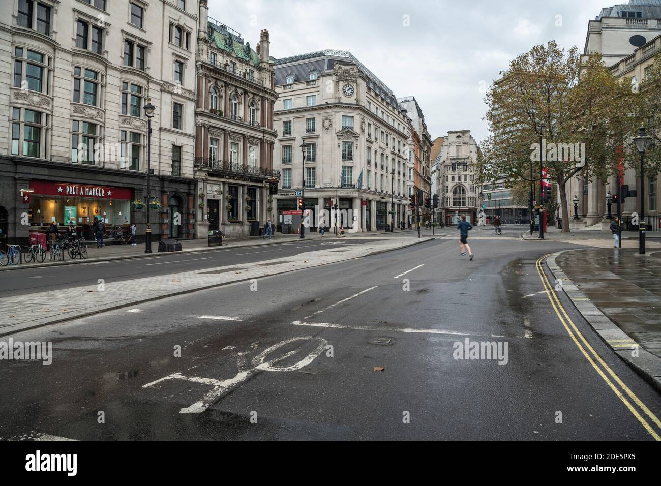 Quiet, empty streets in London with no cars or traffic during Coronavirus Covid-19 pandemic lockdown at Trafalgar Square in London in the City of Westminster, England, UK Stock Photo