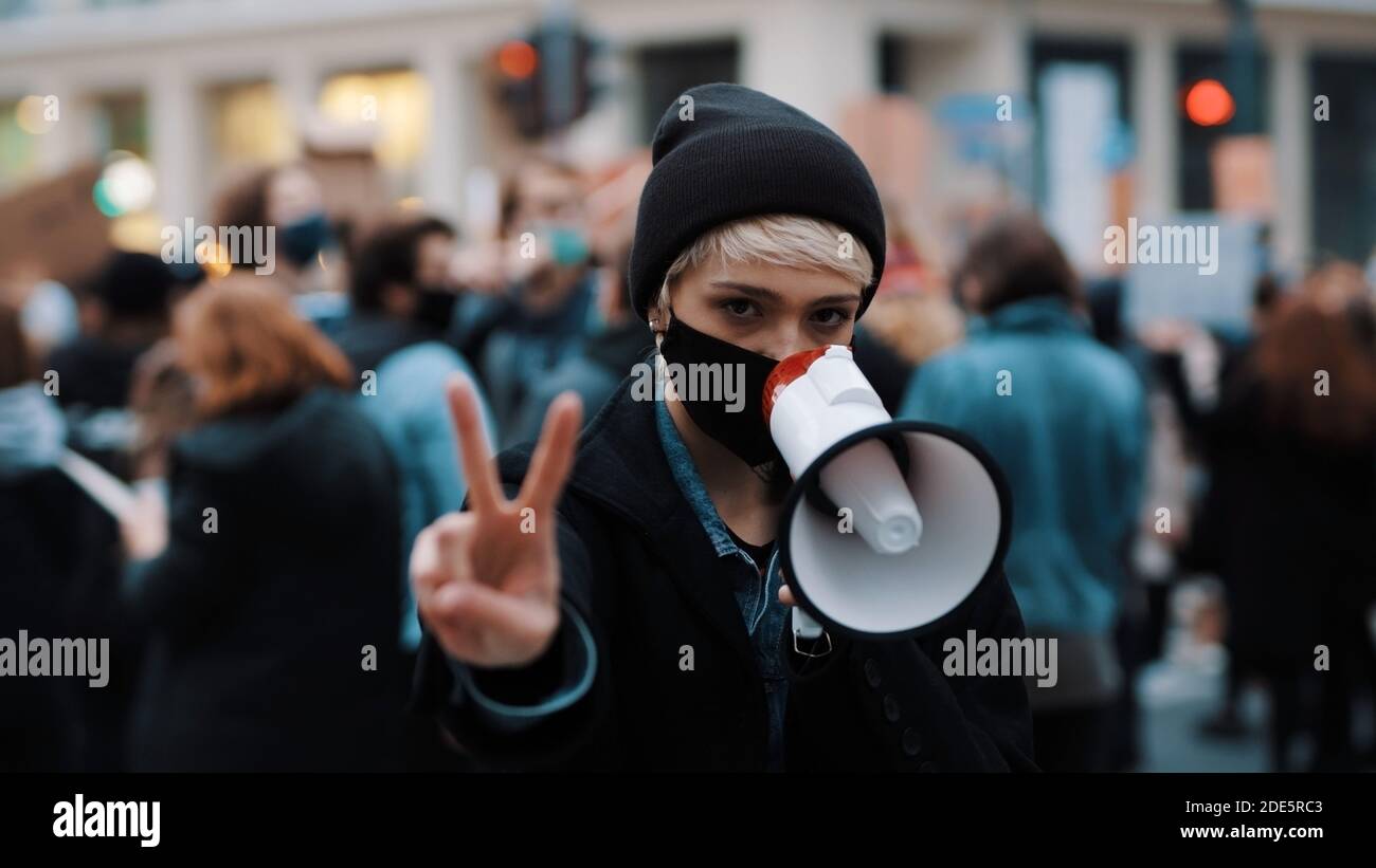 Anti Racism Mask Woman with face mask and megaphone supporting anti-racism protests ...