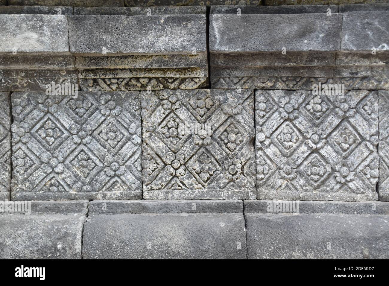 ancient art patterns on the walls of the main temple of the Sojiwan Temple complex in Central Java, Indonesia Stock Photo