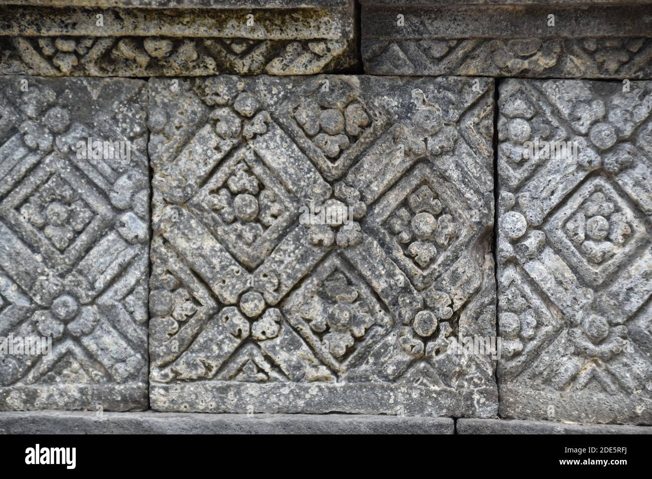 (close view) ancient art patterns on the walls of the main temple of the Sojiwan Temple complex in Central Java, Indonesia Stock Photo