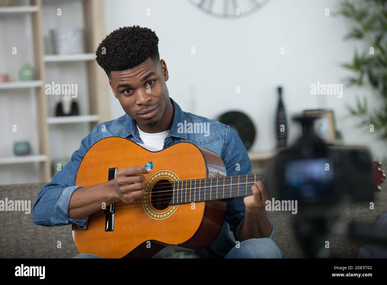 young guitar player recording video for his blog Stock Photo