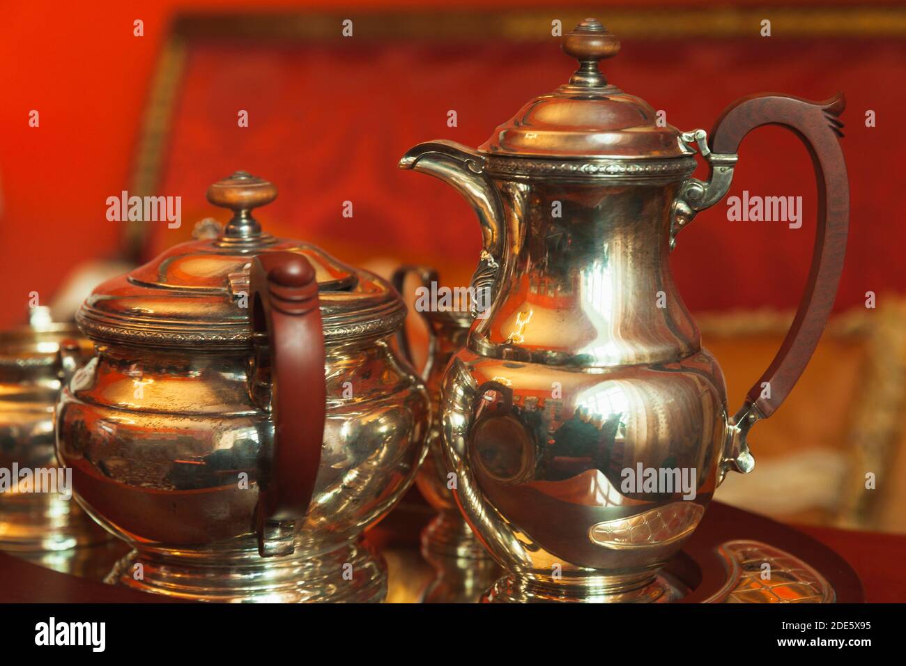 Vintage silver jug and sugar bowl with gilding are on a tray Stock Photo