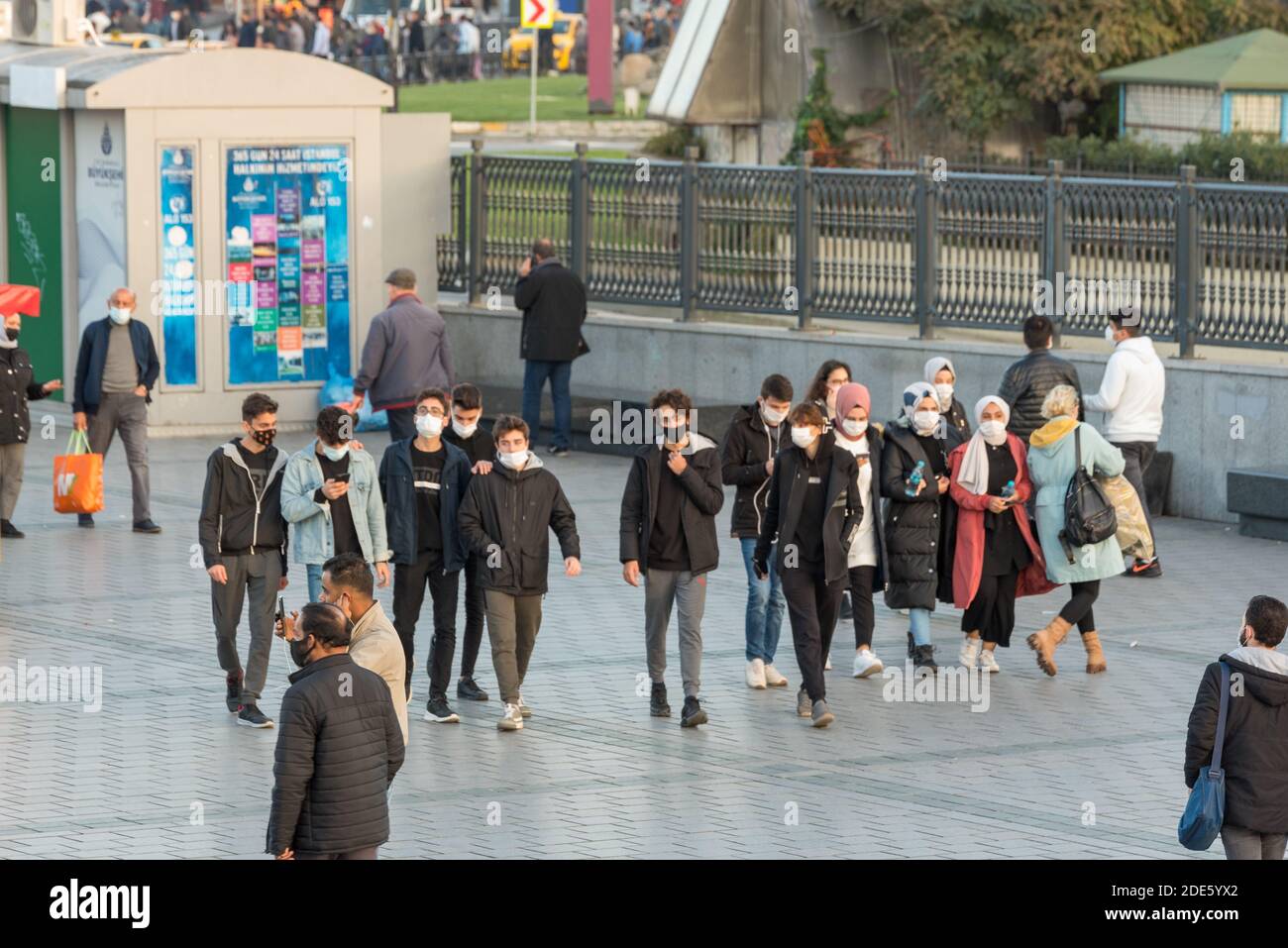 Unidentified Turkish people wearing protective face masks walking closely at the streets without social distance coronavirus COVID-19 epidemic.Istanbu Stock Photo