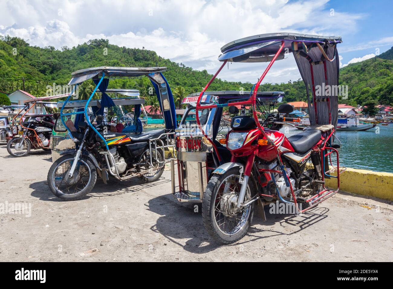 Custom built tricycles, local passenger vehicles in Batangas, Philippines Stock Photo