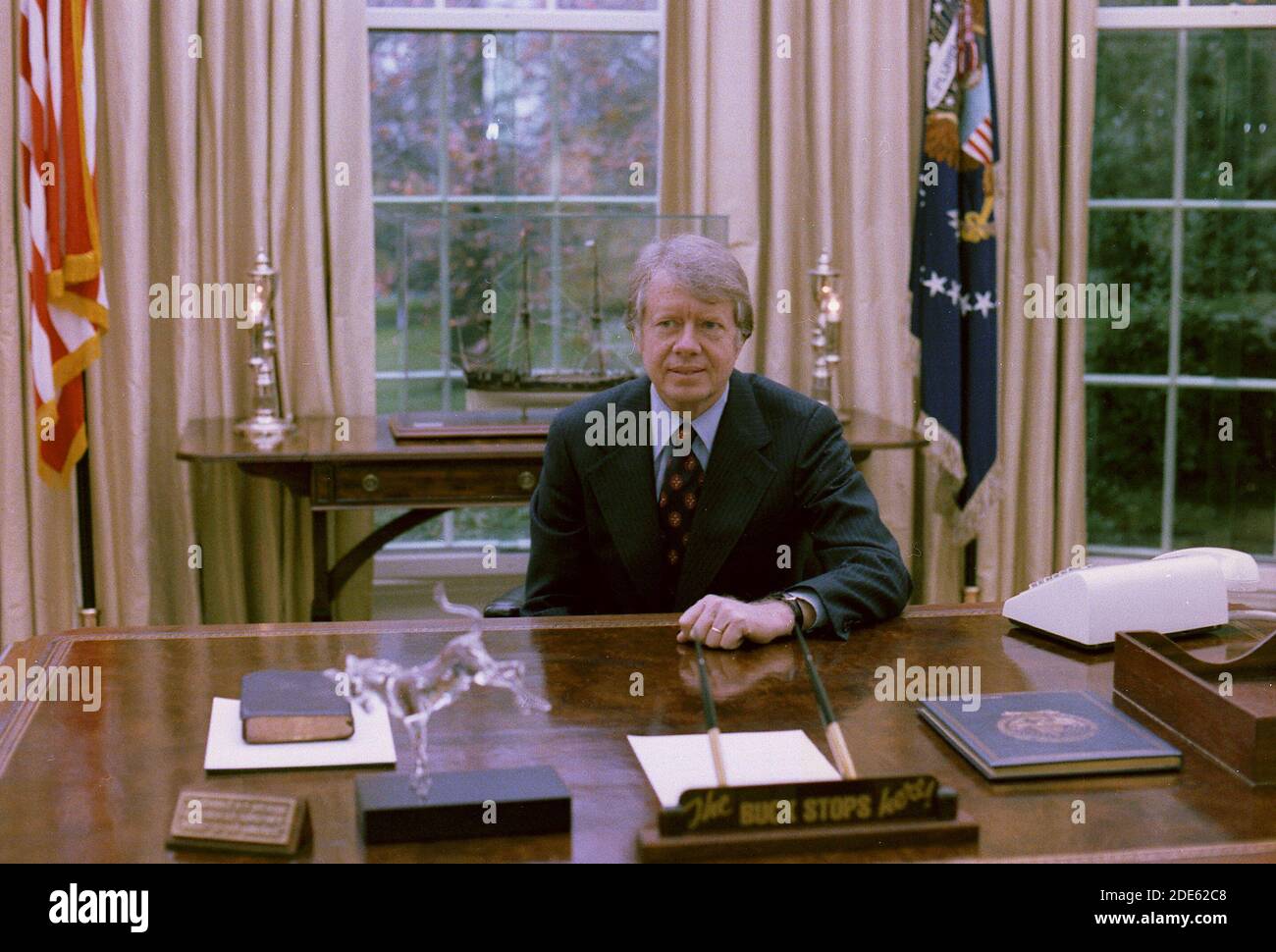 Jimmy Carter at his desk in the Oval Office ca. 23 November 1977 Stock