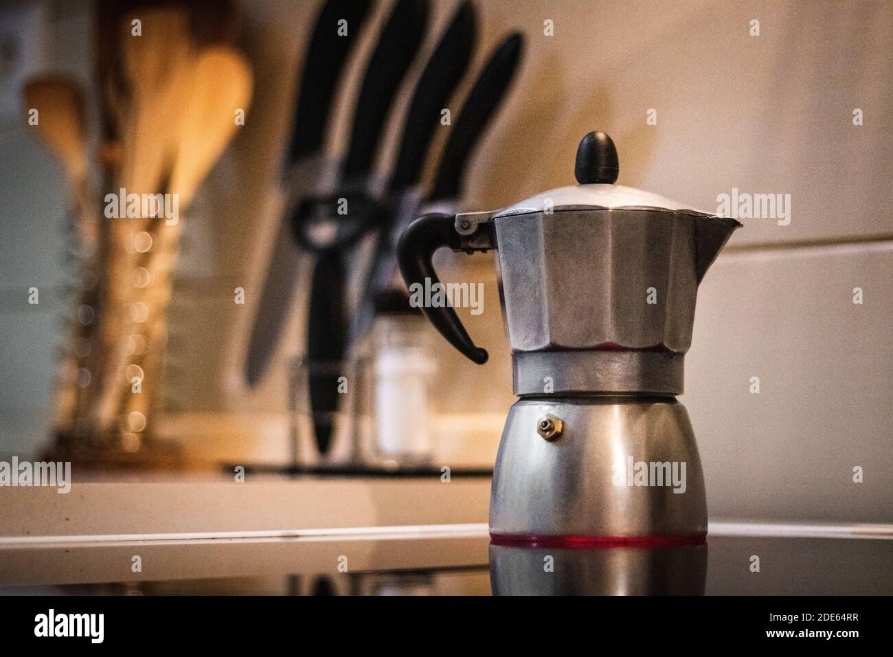 https://c8.alamy.com/comp/2DE64RR/making-coffee-from-boiling-water-on-hot-stove-with-kitchen-counter-in-background-2DE64RR.jpg