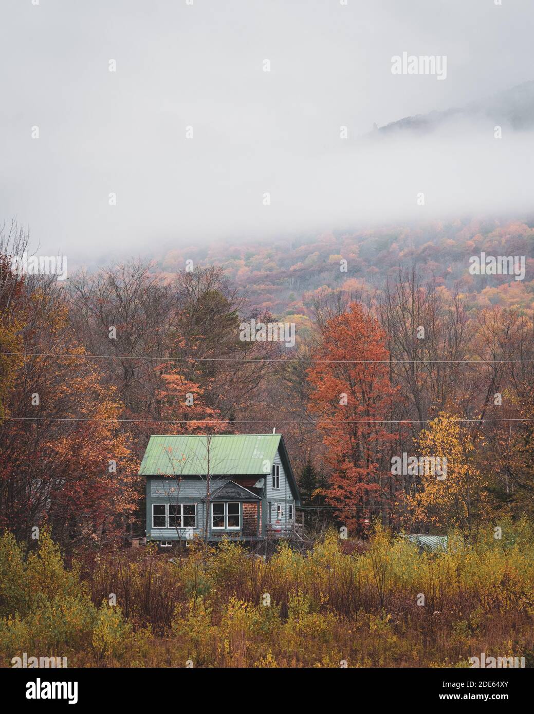 Abandoned house and fog with autumn colors, near Grafton Notch State Park, Maine Stock Photo