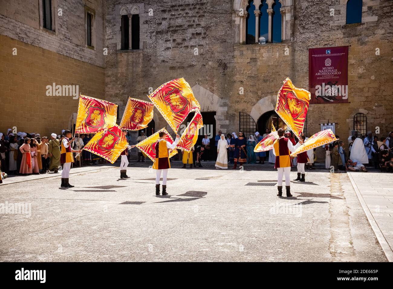 GIOIA DEL COLLE, ITALY - AUGUST 4, 2019: Flag throwers making a performance during the medieval reenactment 'Palio delle botti' Stock Photo