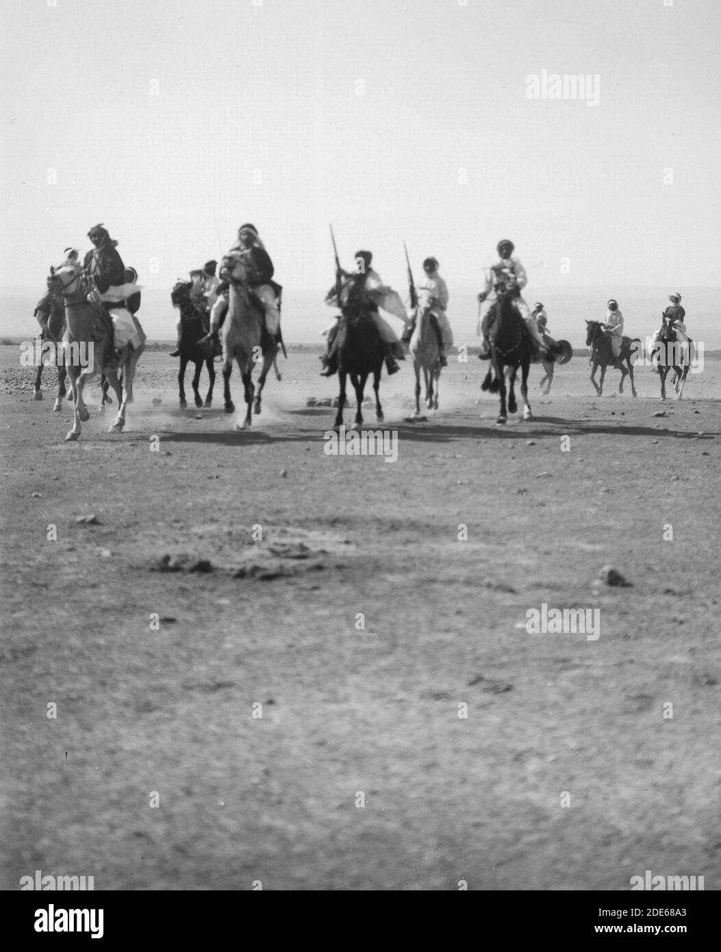 Original Caption: Bedouin wedding series. Mounted Bedouin warriors ...