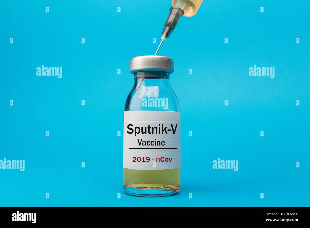 Coronavirus vaccine concept and background. New vaccine sputnik-v isolated on blue background. Covid-19, 2019-nCov pandemic. Stock Photo