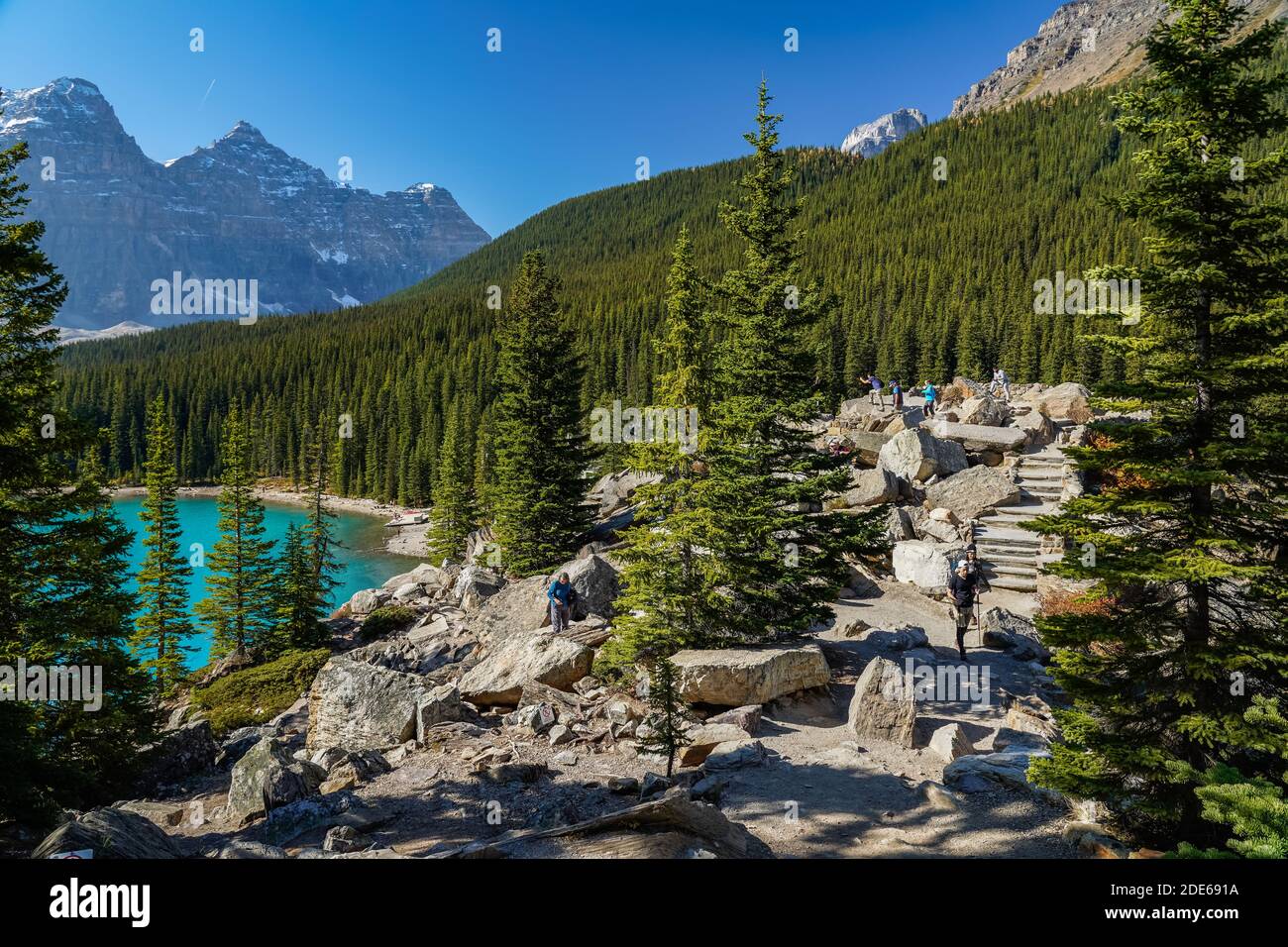 Moraine Lake Rockpile Trail in summer sunny day morning, Tourists enjoying the beautiful scenery. Banff National Park, Canadian Rockies, Alberta Stock Photo