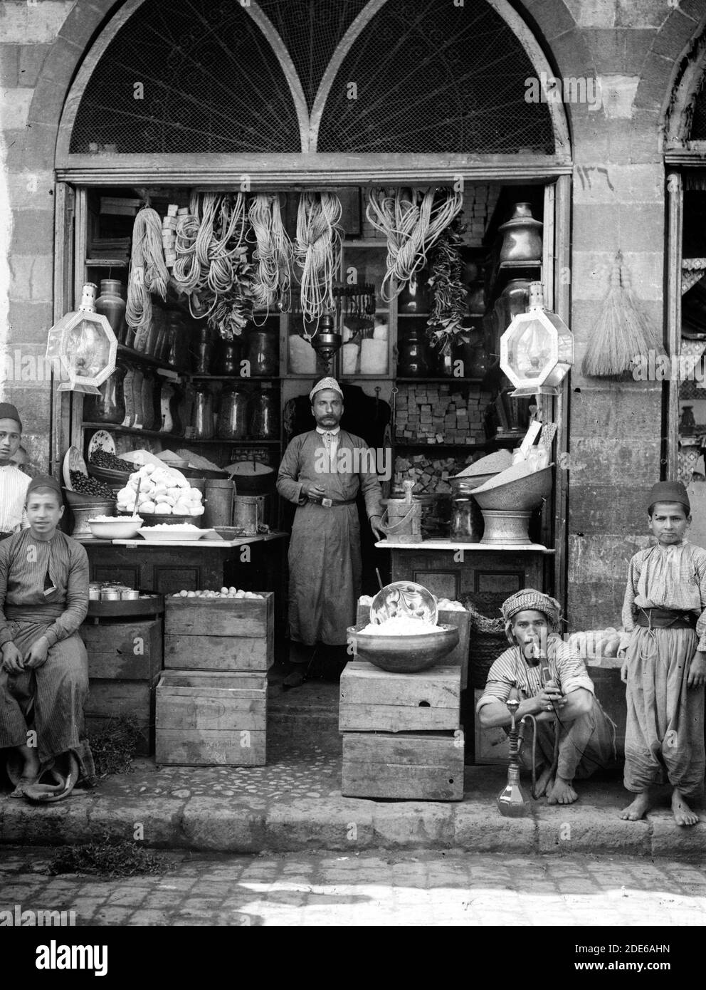 Original Caption: Costumes characters etc. Grocer's shop - Location: ca