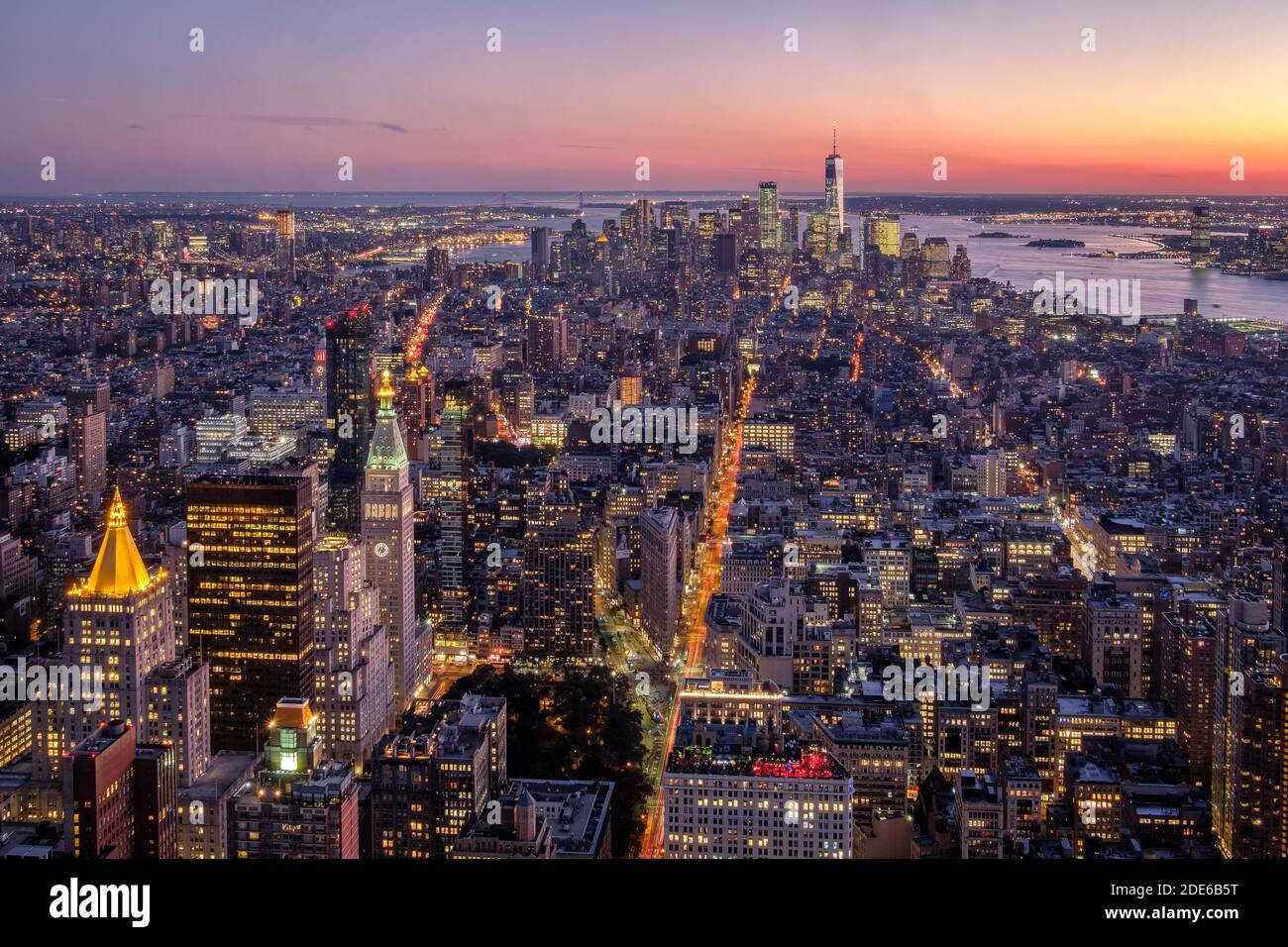 Panorama of Manhattan skyline at night with an illuminated 1 World Trade Center in New York, USA Stock Photo