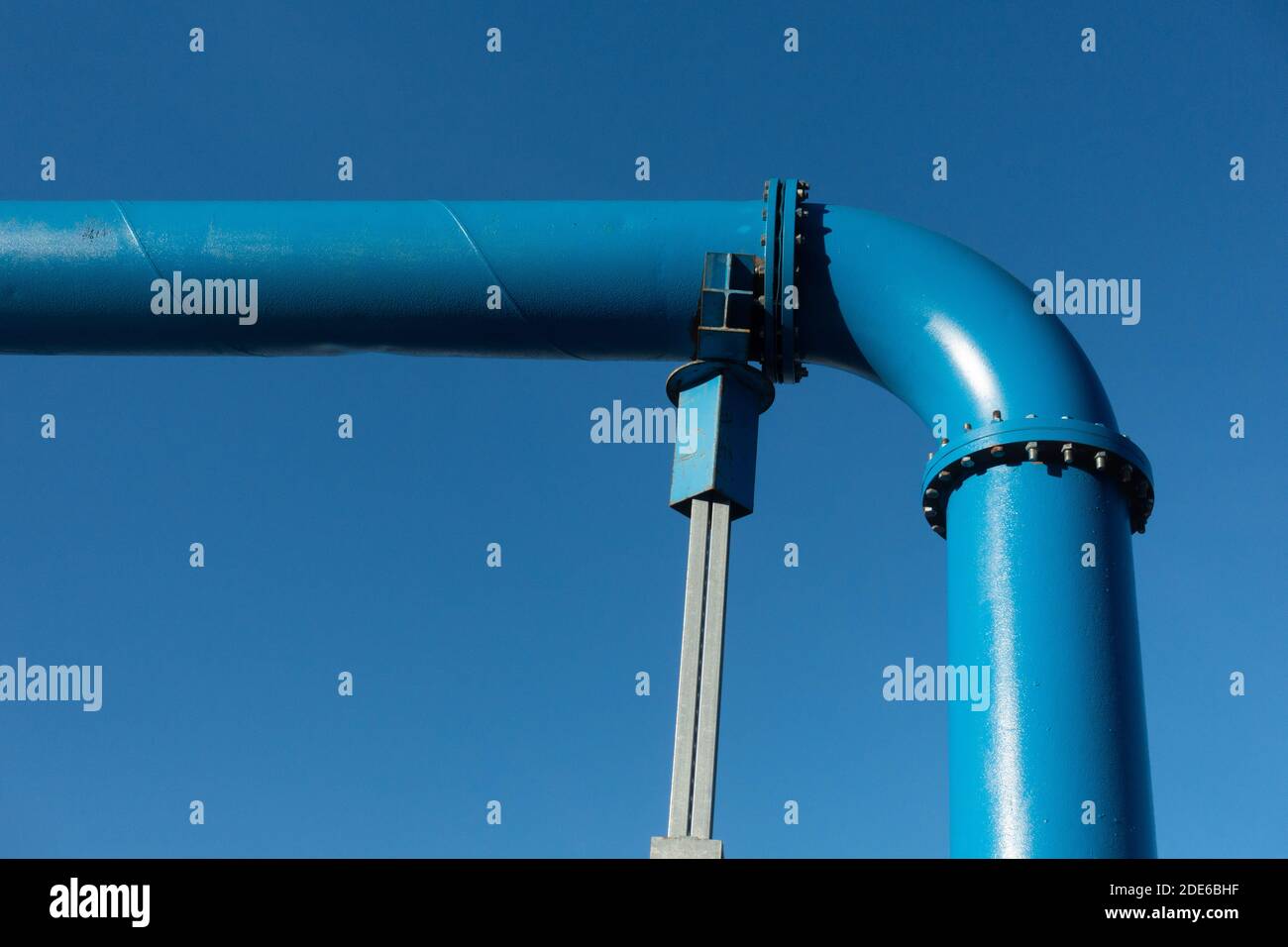 Blue pipe line and a clear blue sky. Gas or fluid distribution system