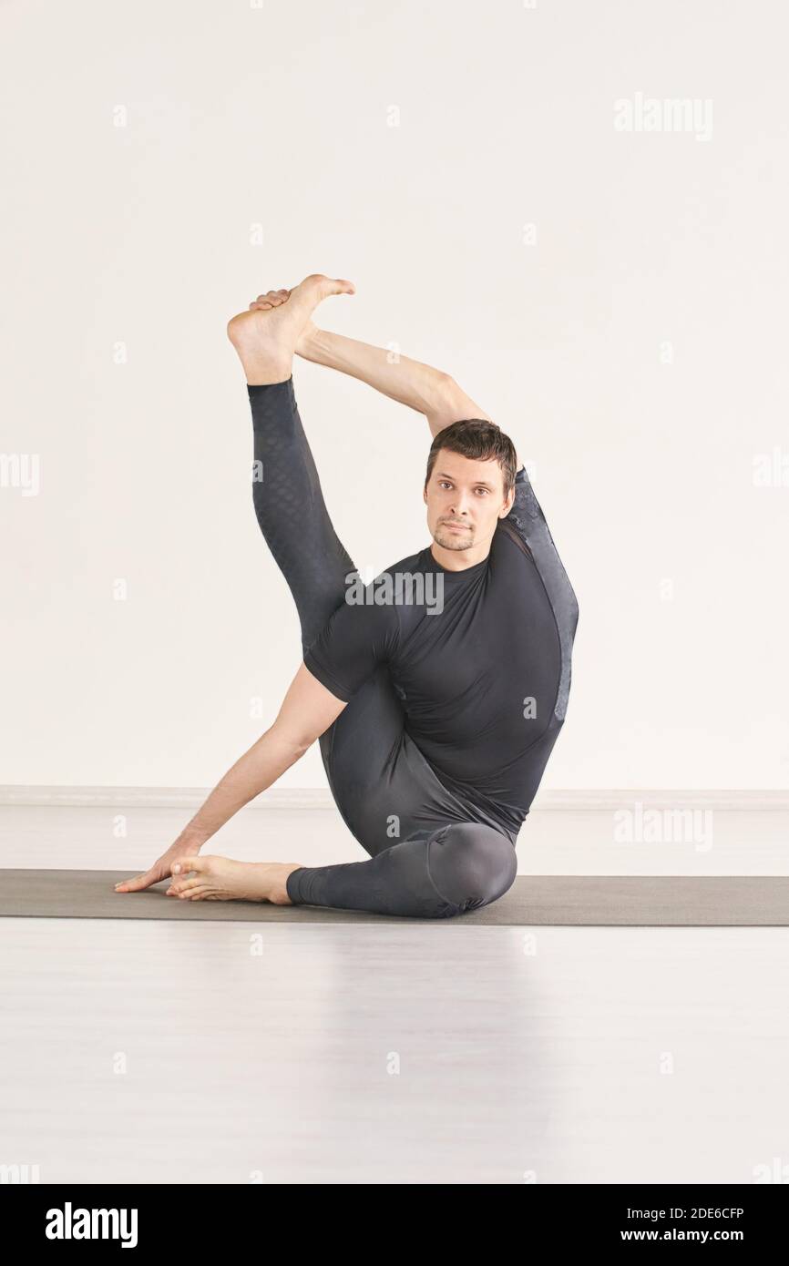Man in yoga asana. Home studio. One person Stock Photo - Alamy