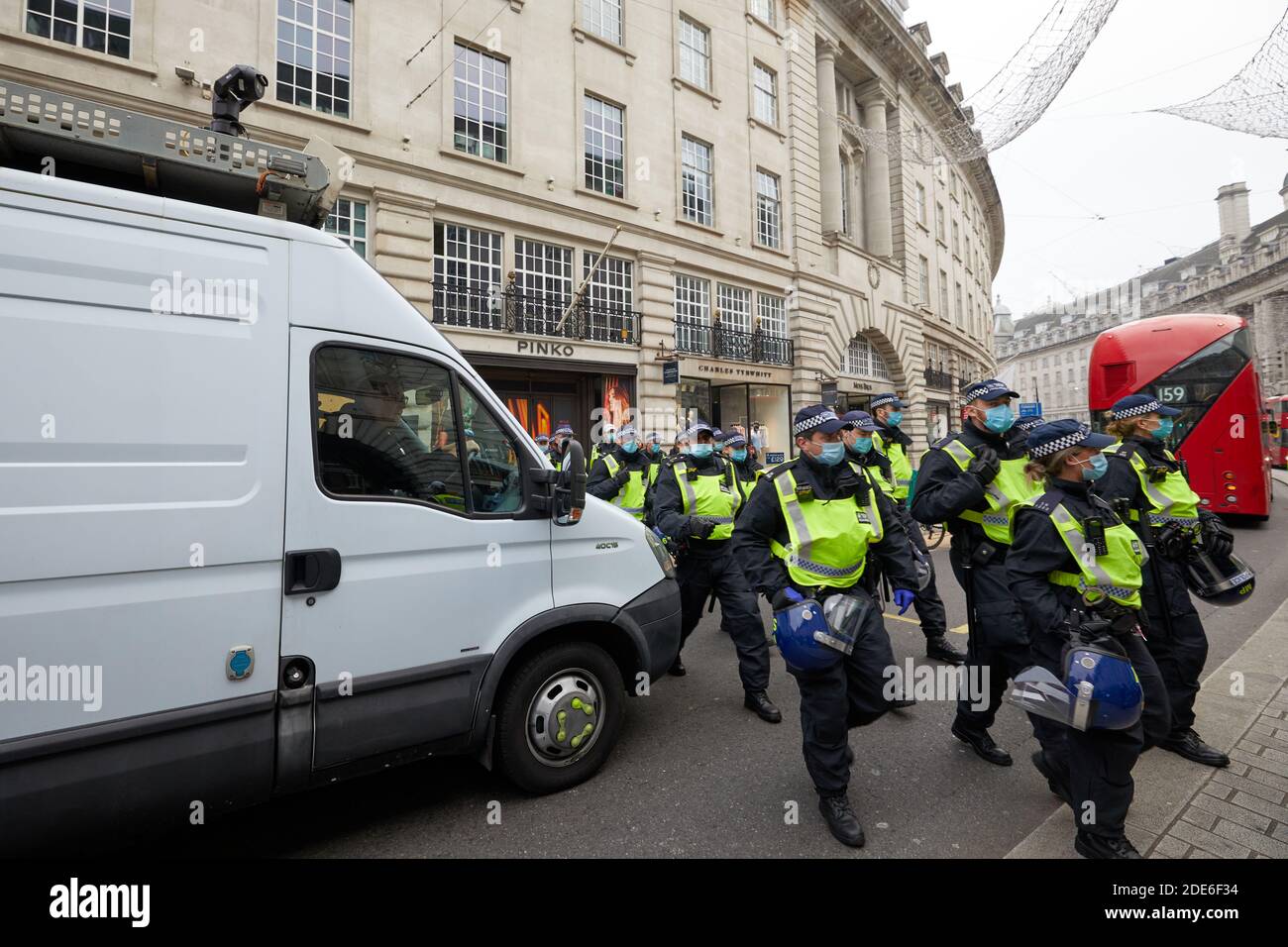 London, UK. - 28 Nov 2020: A heavy police presence next to an unmarked surveillance van at an anti-lockdown protest in the capital. Stock Photo