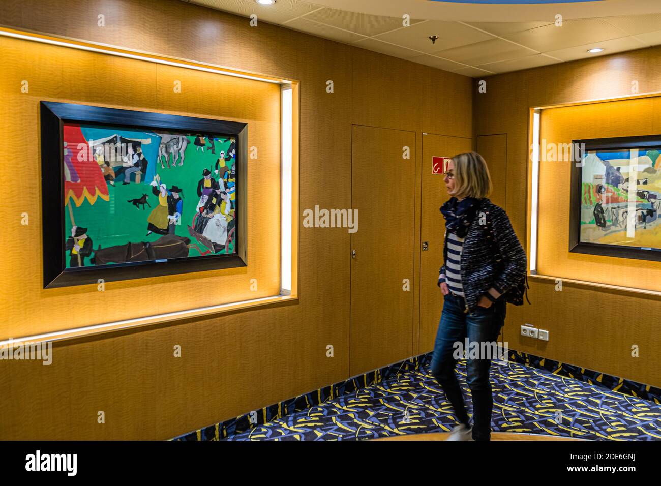 "Art wherever you walk and stand": journalist Angela Berg is amazed by two colourful paintings of Breton rural scenes in the style of the Pont-Aven school, in a cabin corridor of the Pont Aven of Brittany Ferries. Around 1,300 artworks adorn the ship, not only the cabins. Stock Photo