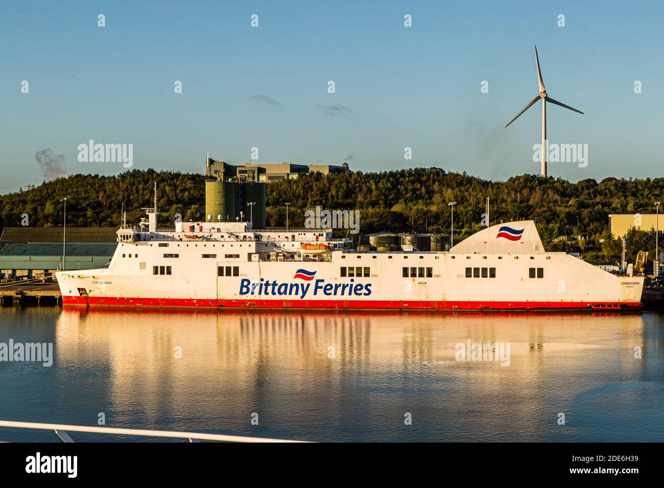 The ro-ro freight ferry "Connemara" of Brittany Ferries lies moored in the port of Cork, Ireland, with a wind turbine turning in the background. The chartered vessel added freight capacity for Brittany Ferries on the Ireland route in 2019. Stock Photo