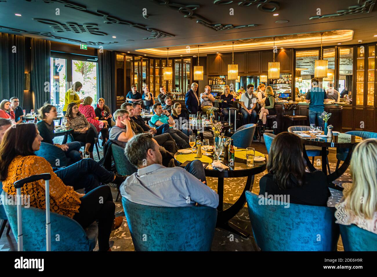 Bar of The Dunloe Hotel near Killarney, Ireland. The bar offers an inviting, cozy atmosphere. It is also well frequented during the day, as here on the occasion of the Rugby World Cup in Japan at the match of the Irish national teamtelevised Rugby Game Stock Photo