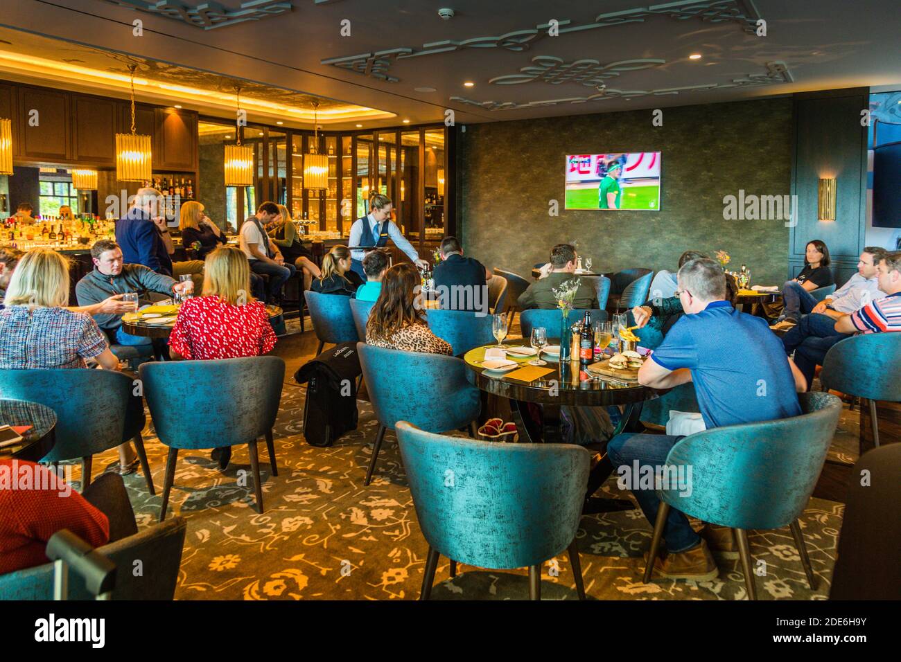Guests watch a match of the Irish rugby team at the World Cup in Japan in the bar of the five-star Dunloe Hotel & Gardens near Killarney, County Kerry, Ireland. Ireland won the pool match against Samoa 47-5 on this day, 12 October 2019. Stock Photo