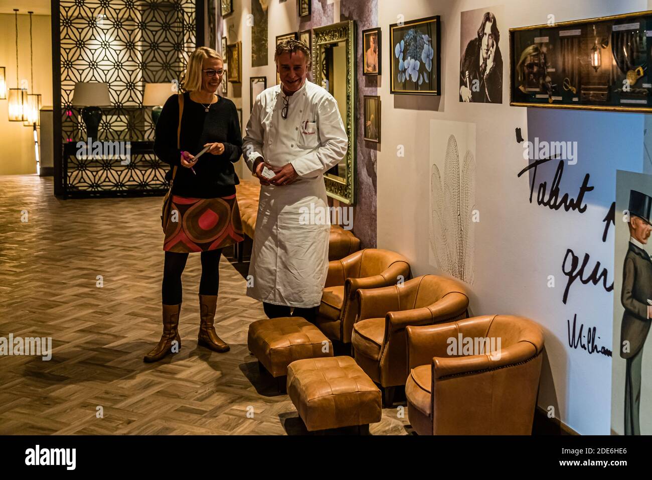 Head chef Jupp Osterloh poses with journalist Angela Berg in the Upper Lounge of the 5-star Dunloe Hotel & Gardens near Killarney, County Kerry, Ireland. Stock Photo