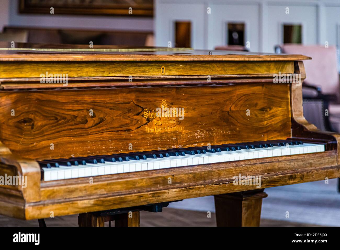 "Steinway & Sons, Patent Grand, New York & Hamburg" is lettered in gold on the grand piano at the five-star Dunloe Hotel & Gardens near Killarney, County Kerry, Ireland. Stock Photo