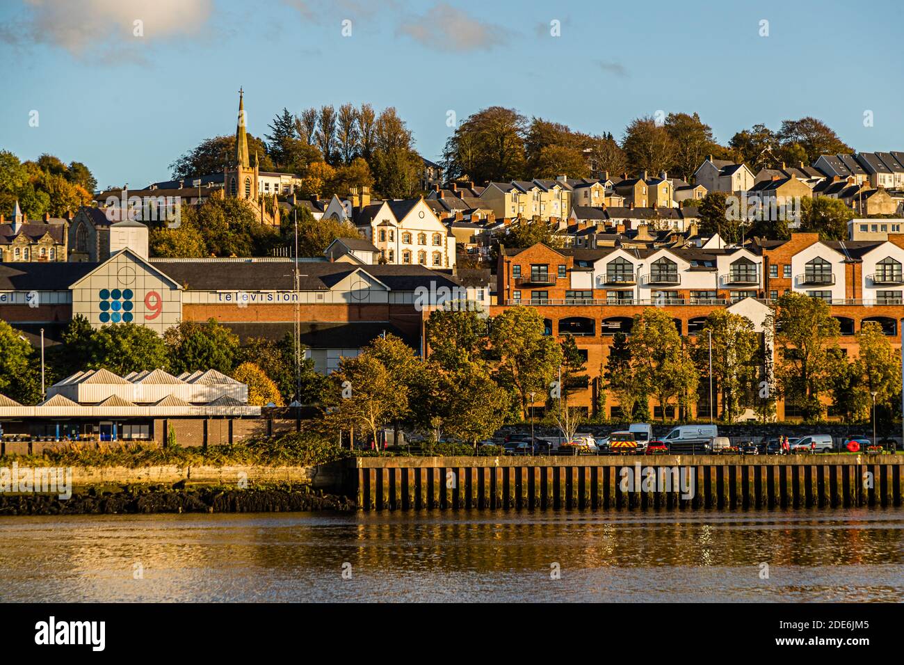 The River Foyle lies at dusk along Foyle Street in Londonderry, County Derry, Northern Ireland. Stock Photo