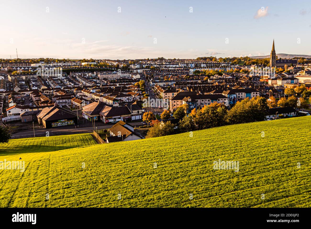 The Saint Columbs Court neighbourhood lies at dusk in Londonderry, County Derry, Northern Ireland. Stock Photo