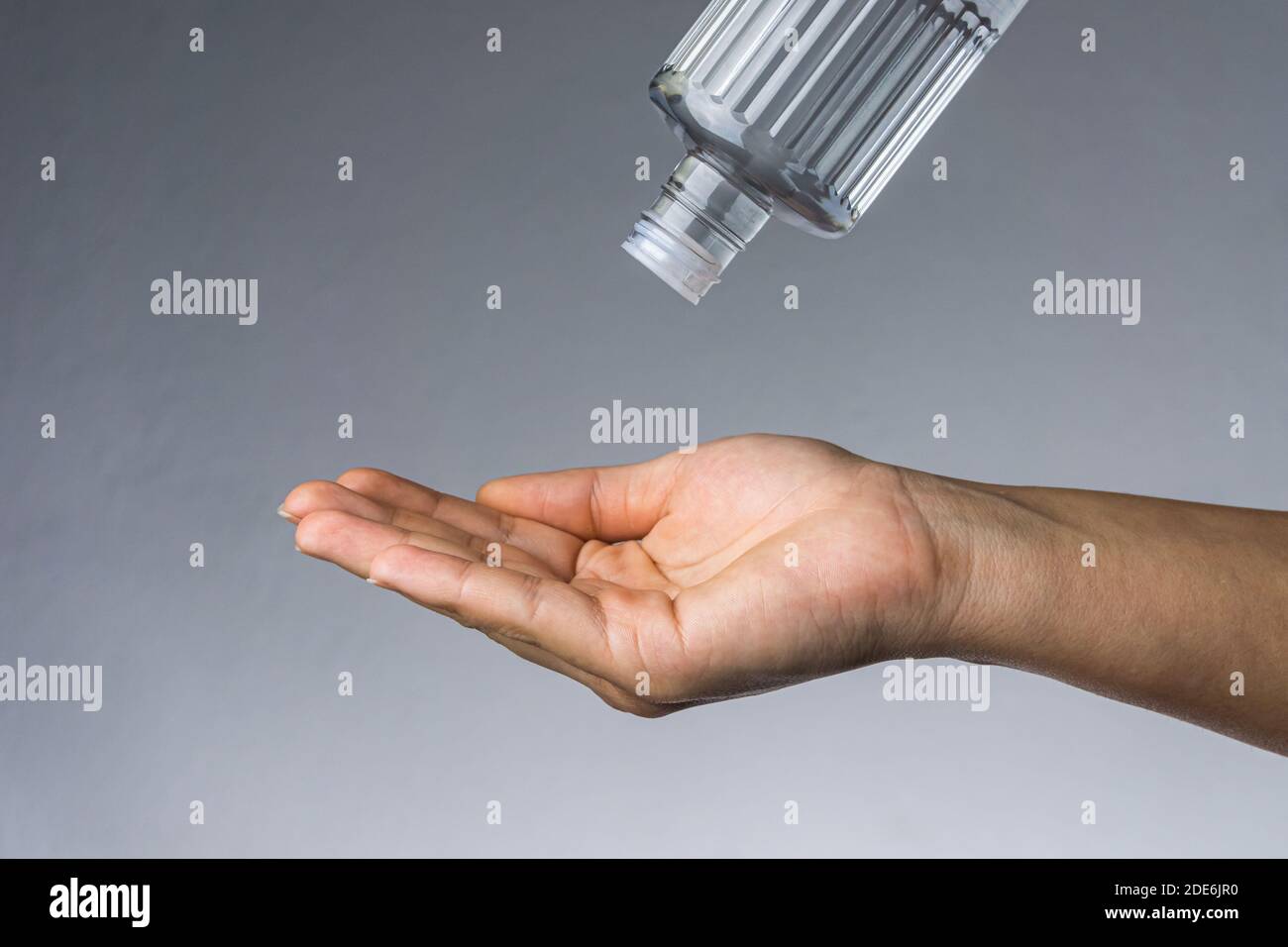 Woman applying Turkish disinfectant on her hand. Coronavirus transmission with a hands Stock Photo