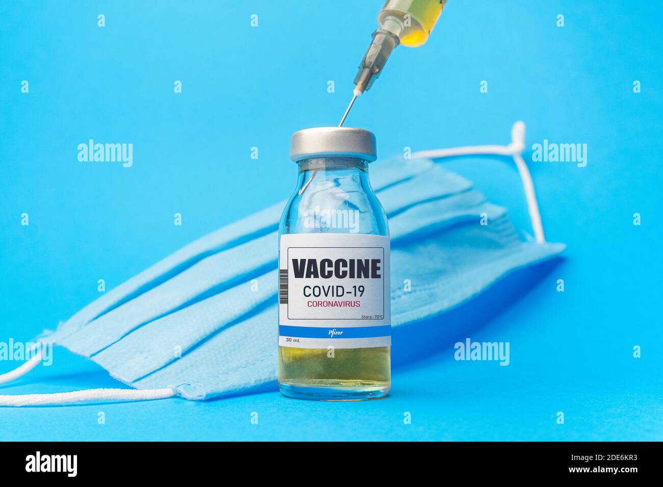 Izmir, Turkey - January 17 2021: Coronavirus vaccine concept and background. New vaccine pfizer and biontech isolated on blue background. Covid-19 Stock Photo