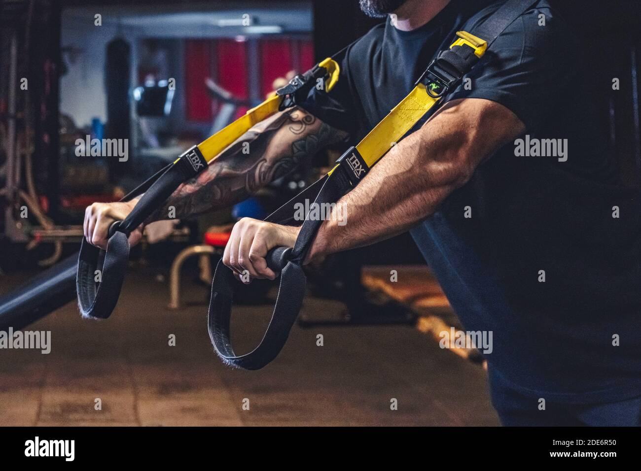 Man Does Crossfit exercise With Trx Fitness Straps In Gym Stock Photo ...