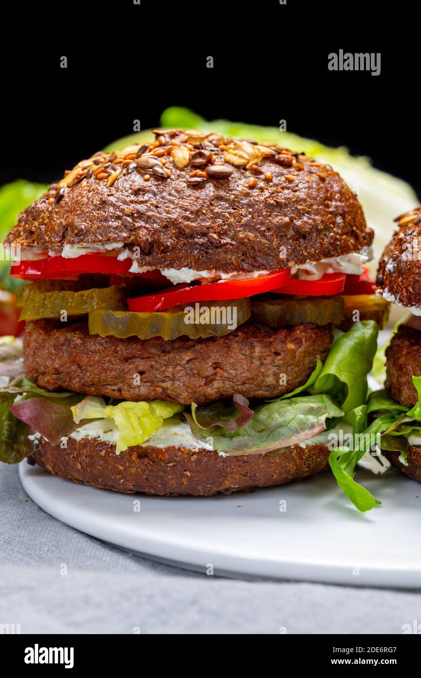 Vegan hamburgers with grilled healthy plant based, meat free burgers