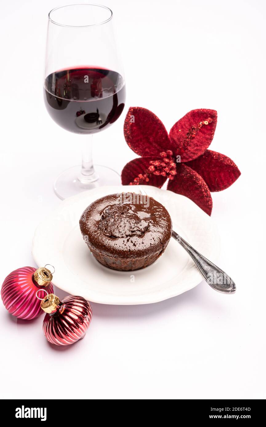 Popular british christmas food, glass of vintage ruby port wine and hot chocolate cake with christmas decoration on background isolated on white Stock Photo