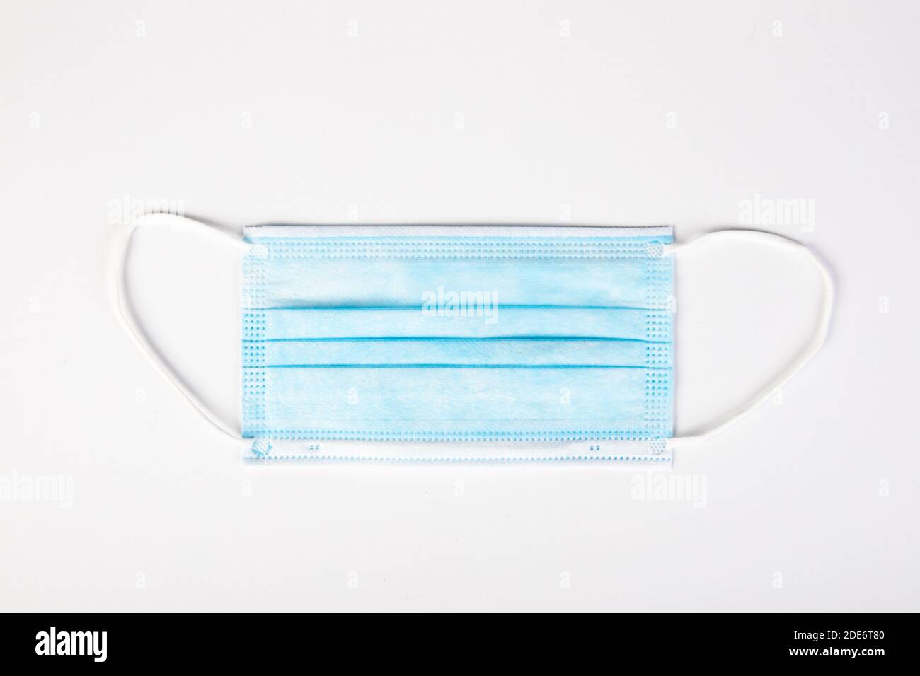 blue mouth protection mask on white background, copy space Stock Photo