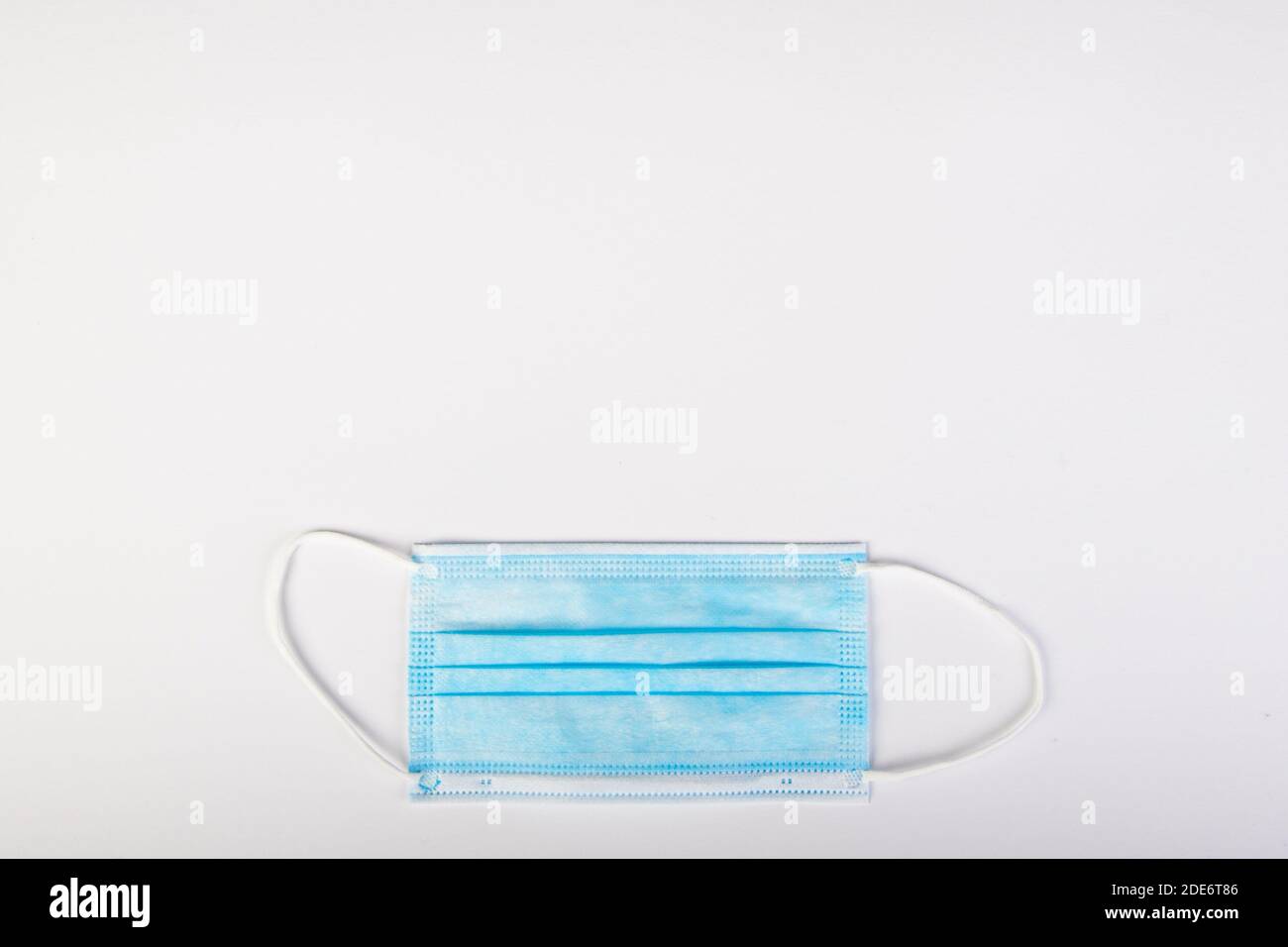 blue mouth protection mask on white background, copy space Stock Photo