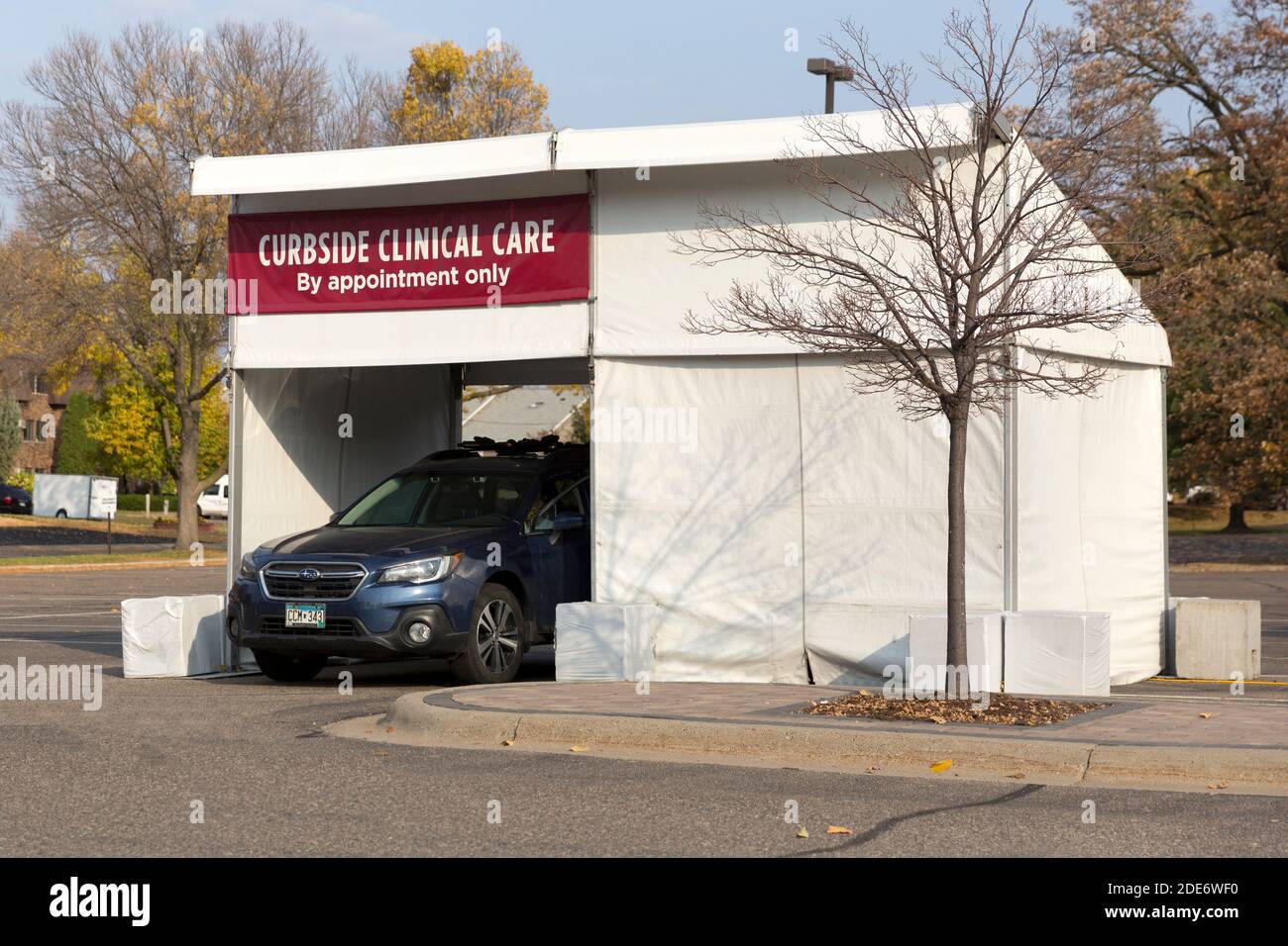 An outside curbside drive-through temporary medical clinic tent used for flu shots and testing during a pandemic Stock Photo