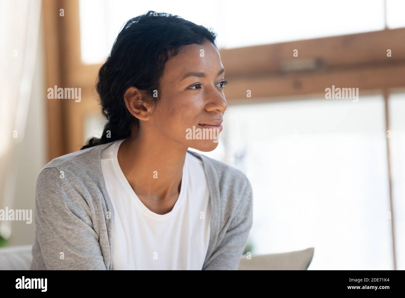 Woman Look Behavior Dreamy biracial woman look in distance visualizing Stock Photo - Alamy