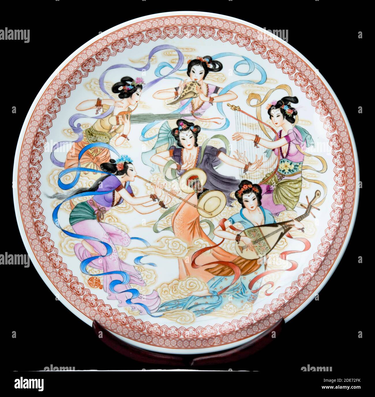 Antique Chinese porcelain charger of musical girls. Stock Photo